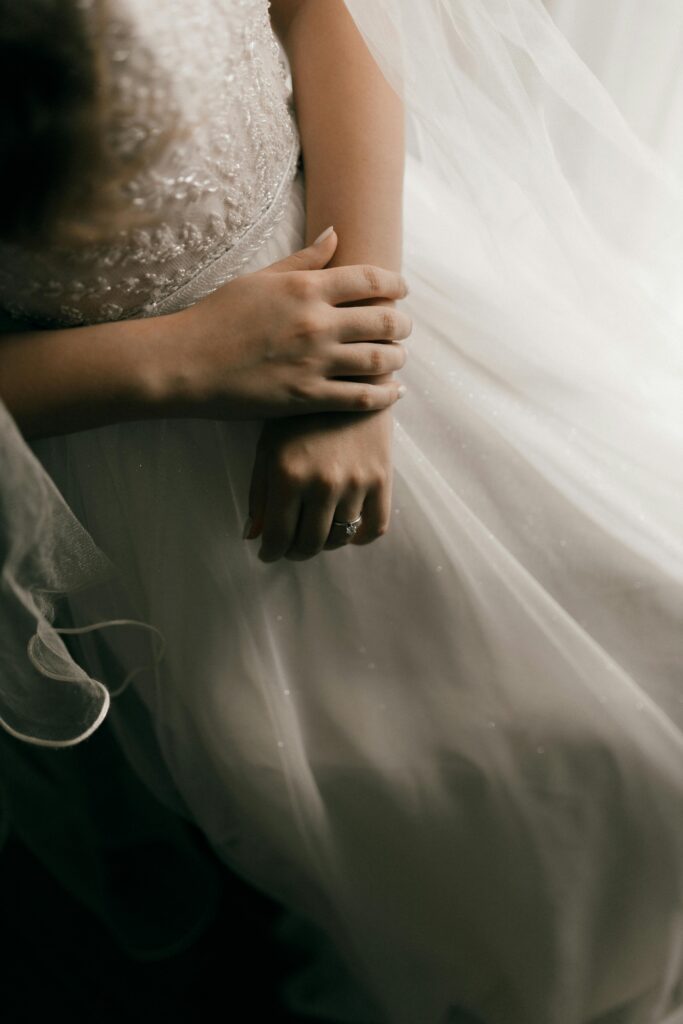 Image of women in white dress for blog What Carat Diamond Should I Choose For My Bespoke Diamond Engagement Ring